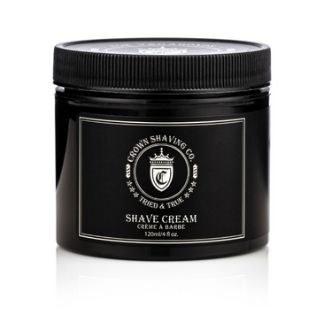 This image shows a black jar of Crown Shaving Co. Shave Cream with a black, ribbed lid. The label includes the brand's logo and the product name
